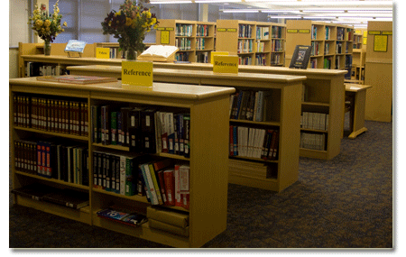Library stacks which house a reference section, loose and bound journals, media, and over 1200 books.