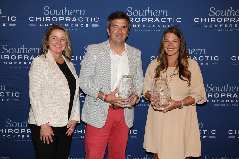 Logan University alumni honored with crystal awards at a chiropractic conference