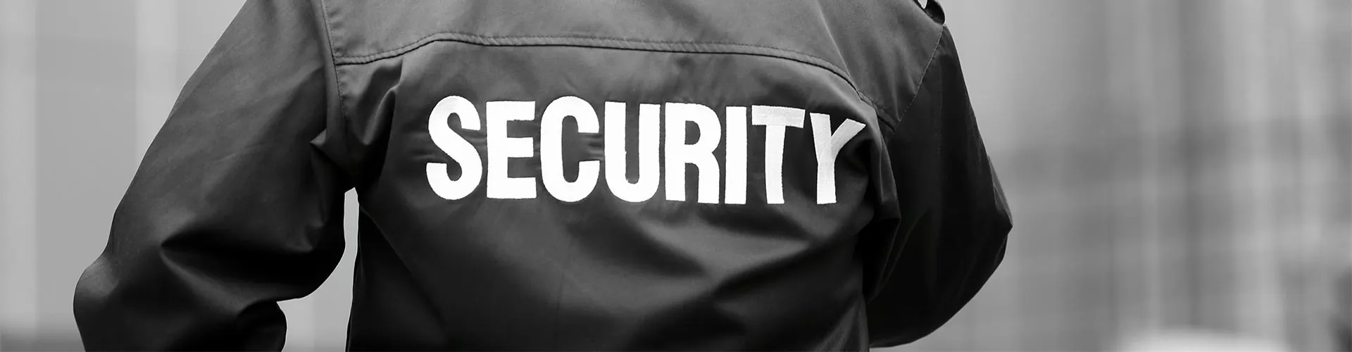 Security officer in a jacket marked SECURITY