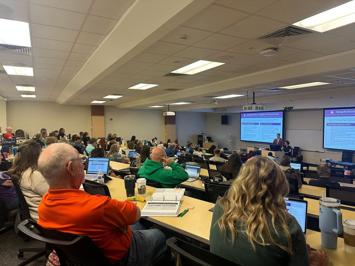 Practitioners filling a Logan lecture hall for a continuing education seminar presentation