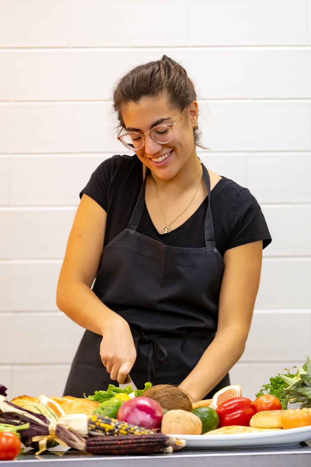 A dietetics student preparing a meal plan in the teaching kitchen