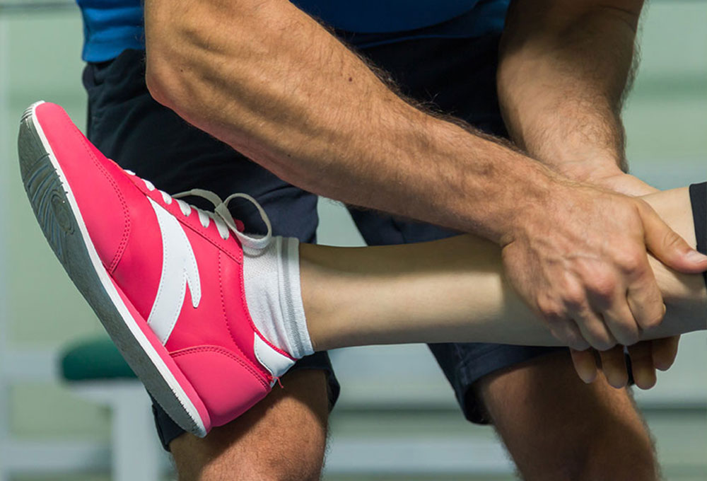 Trainer working with athlete.