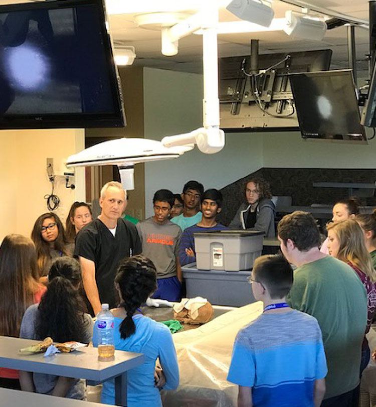 Instructor teaching students in the anatomy lab