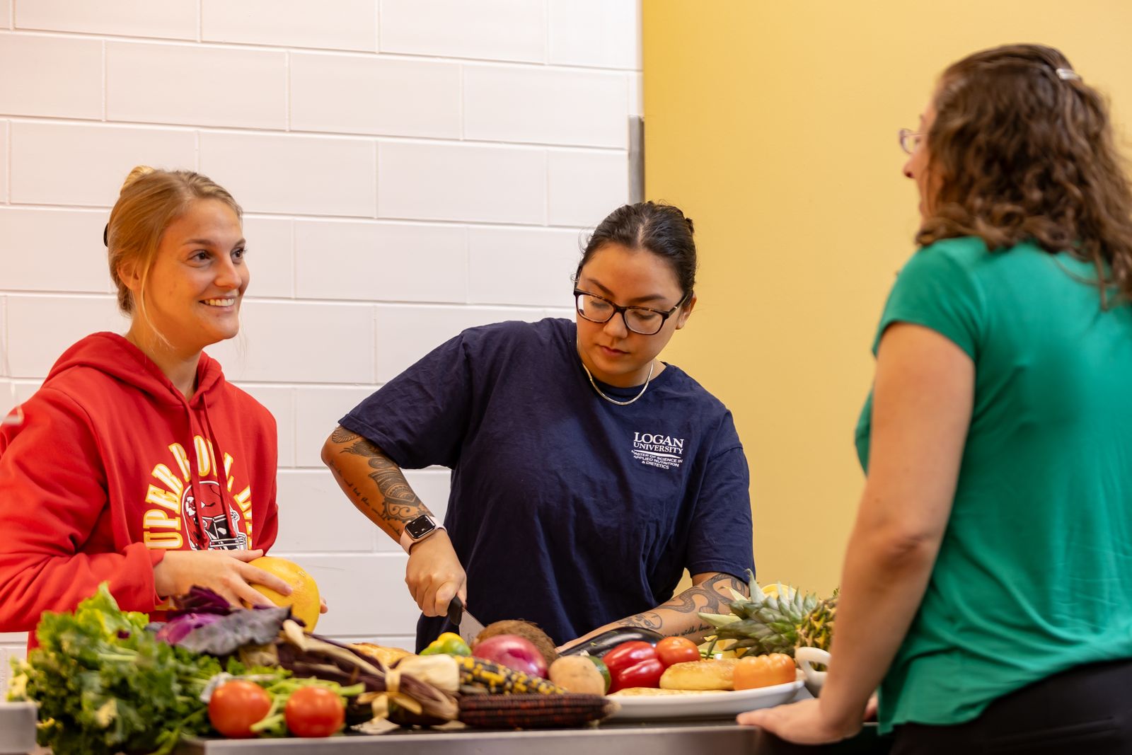 A Logan University faculty member mentoring a student