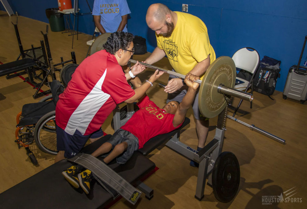 Two USAPP coaches working with young athlete.