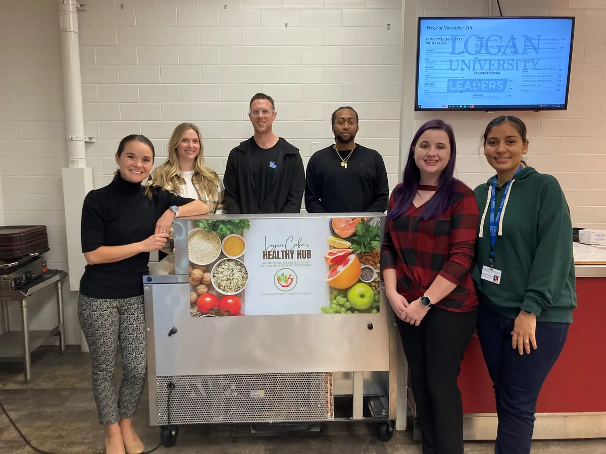 MS-AND students stand in front of the Healthy Hub in the Logan Cafe