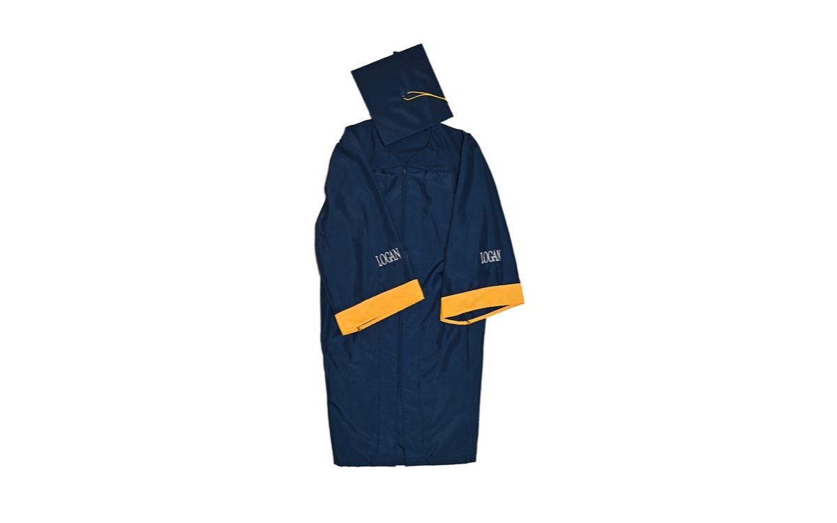Bachelor's regalia laid flat: cap and tassel with gown