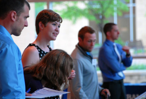 Students speaking at an event at Logan