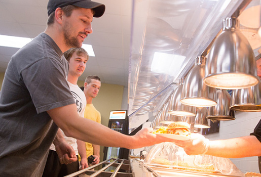 getting food in line in Logan cafeteria