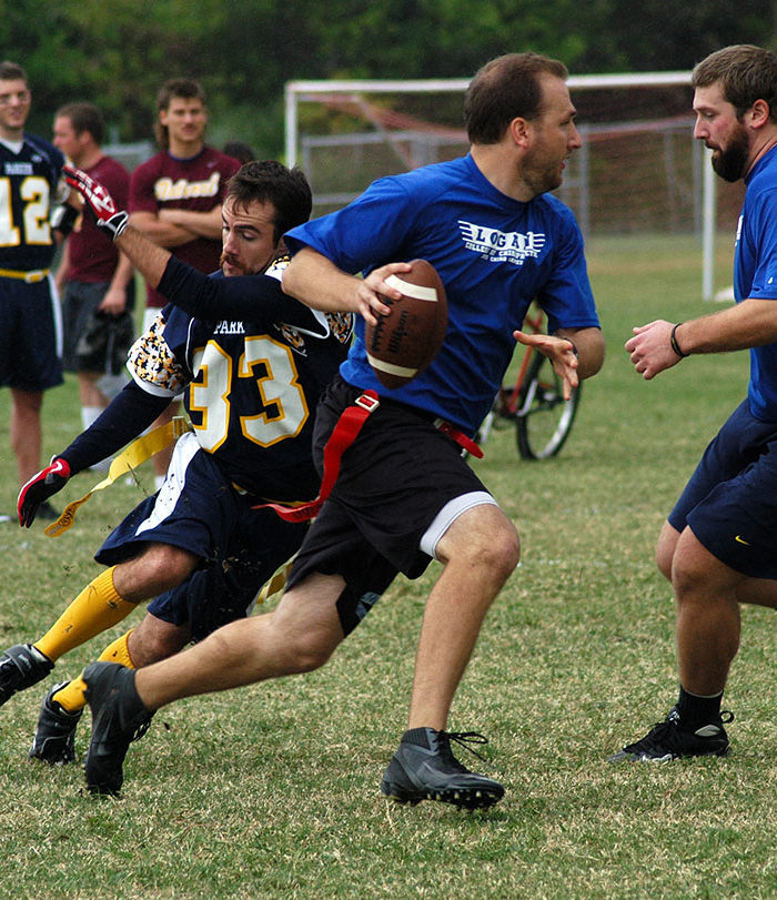 Students playing flag football.