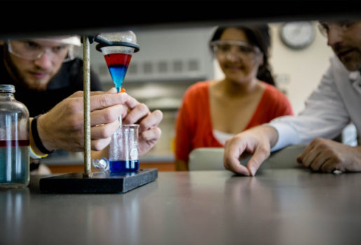 Close up of students in lab doing an experiment