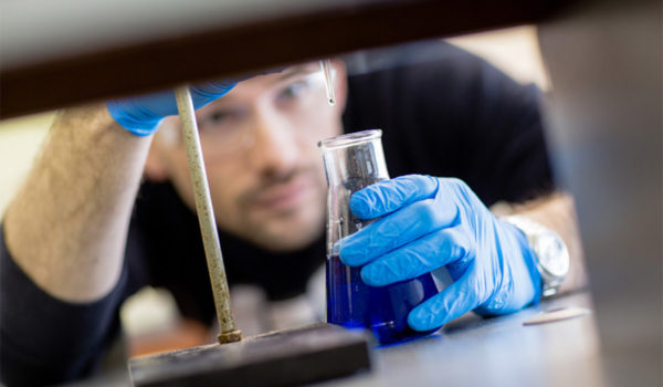 Close-up of student doing experiment