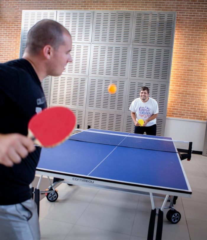 Students playing ping pong.