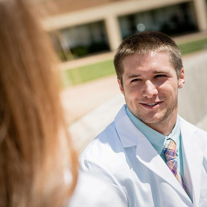 Student smiling on campus