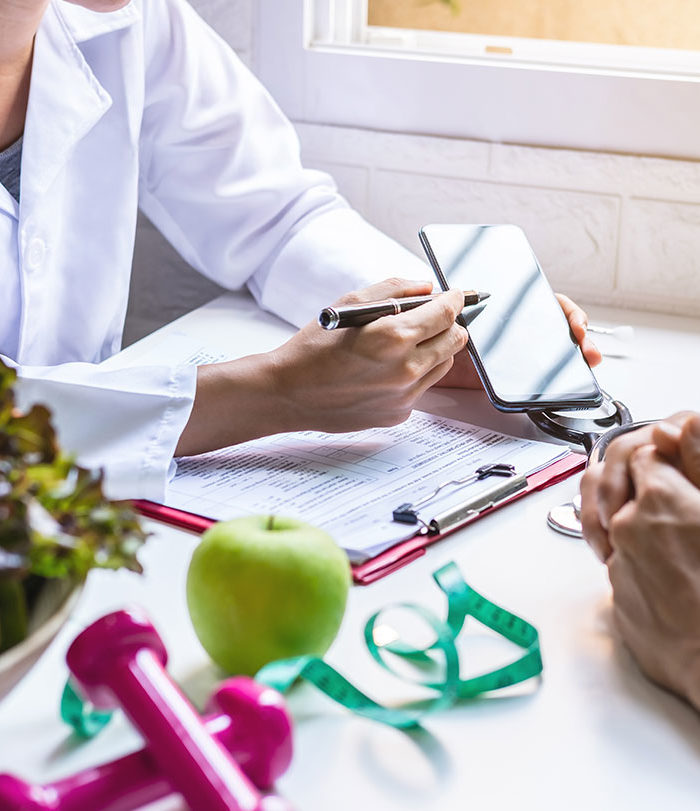 Dietician working with patient.