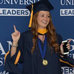 Female student celebrating graduation.