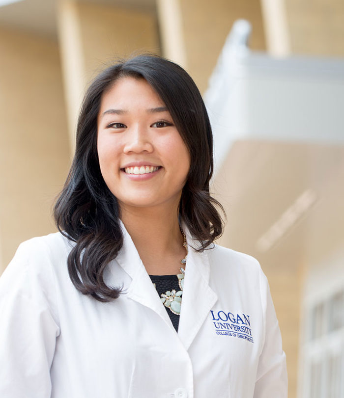 Logan student smiling on campus.