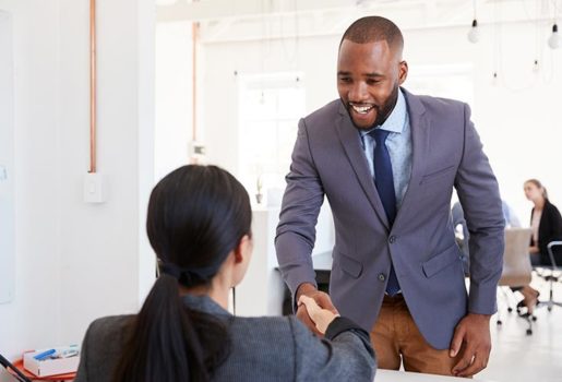 Male shaking hands before interview.