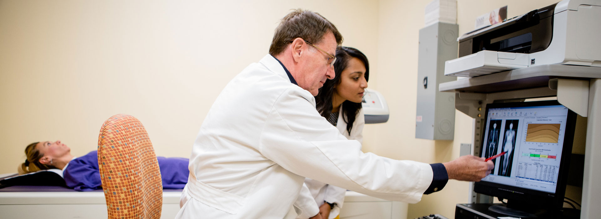 Student and instructor working in radiology lab.