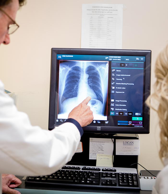 Instructor and student working in radiology lab.