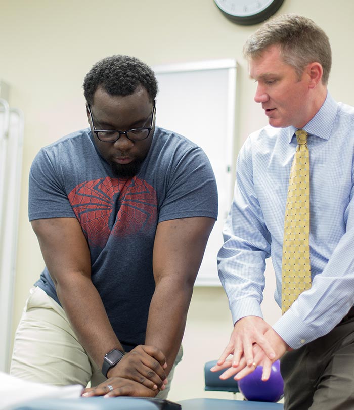 Instructor and student working together.