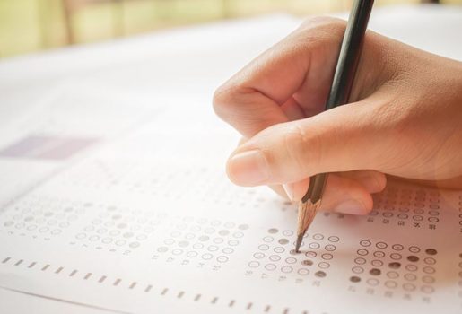 Close up of hand taking test.