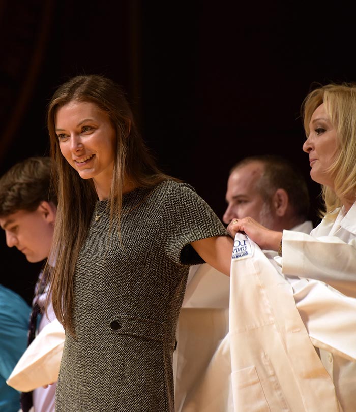 Female student at White Coat Ceremony.