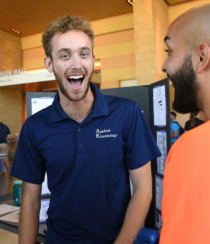 Male student smiling during Club Day.