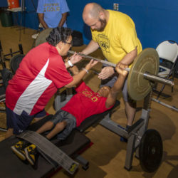 Two USAPP coaches working with young athlete.
