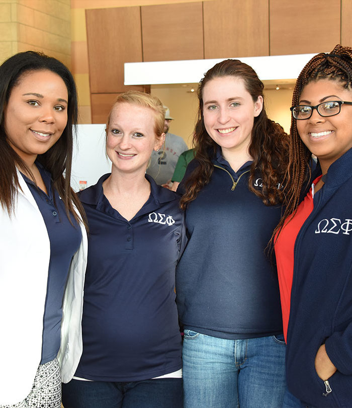 Female sorority students smiling for picture.