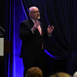 Dr. McDonald speaking at Spring Symposium.