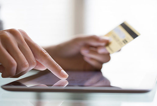 Closeup of woman making payment.