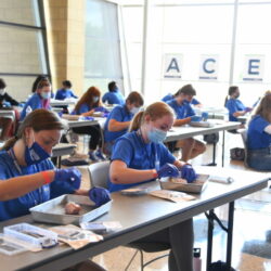 High school students learn about suturing at Logan University's fourth annual Anatomy Centered Education and Science Workshop