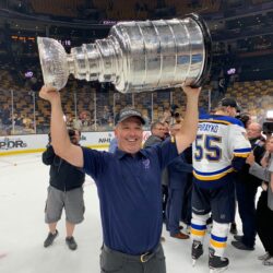 St. Louis Blues Team Chiropractor Dr. Mike Murphy Hoists the Stanley Cup on the Ice Following the Franchise's First Championship in June 2019