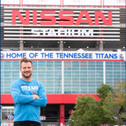 Dr. Ben Johnson, Team Chiropractor for the Tennessee Titans, stands outside of Nissan Stadium