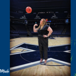 Sierra Girton throws a basketball into the air while standing on a basketball court